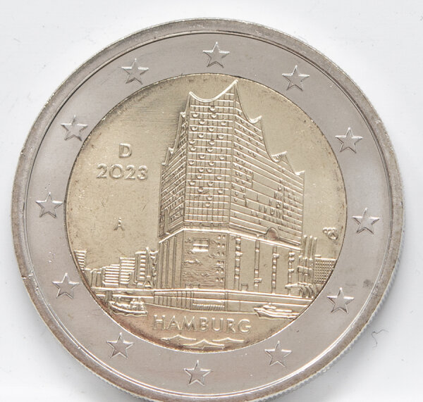 Runde Münze mit geprägtem Portraitprofil-Motiv, Brilliant Uncirculated, feine Oberflächenstruktur.
