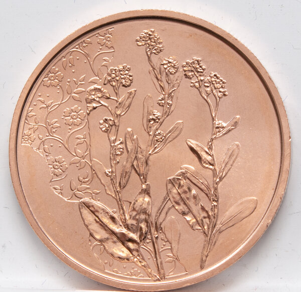 Runde Münze mit geprägtem Portraitprofil-Motiv, Brilliant Uncirculated, feine Oberflächenstruktur.