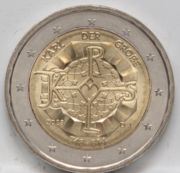 Runde Münze mit geprägtem Portraitprofil-Motiv, Brilliant Uncirculated, feine Oberflächenstruktur.