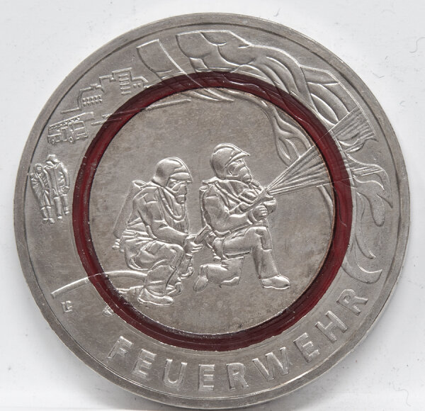 Runde Münze mit geprägtem Portraitprofil-Motiv, Brilliant Uncirculated, feine Oberflächenstruktur.