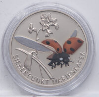 Runde Münze mit geprägtem Portraitprofil-Motiv,...