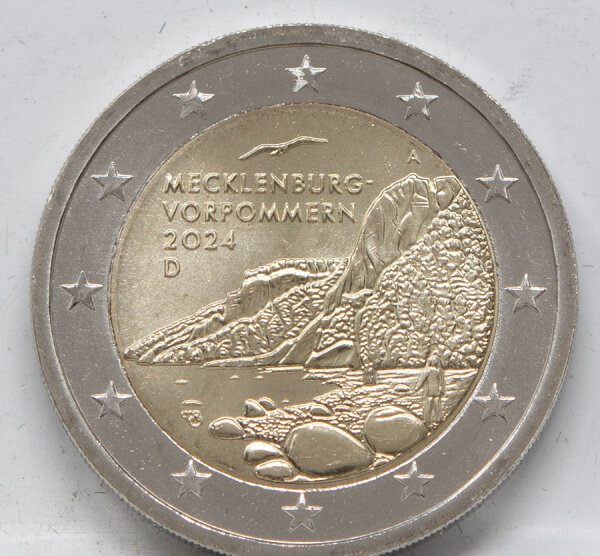 Runde Münze mit geprägtem Portraitprofil-Motiv, Brilliant Uncirculated, feine Oberflächenstruktur.