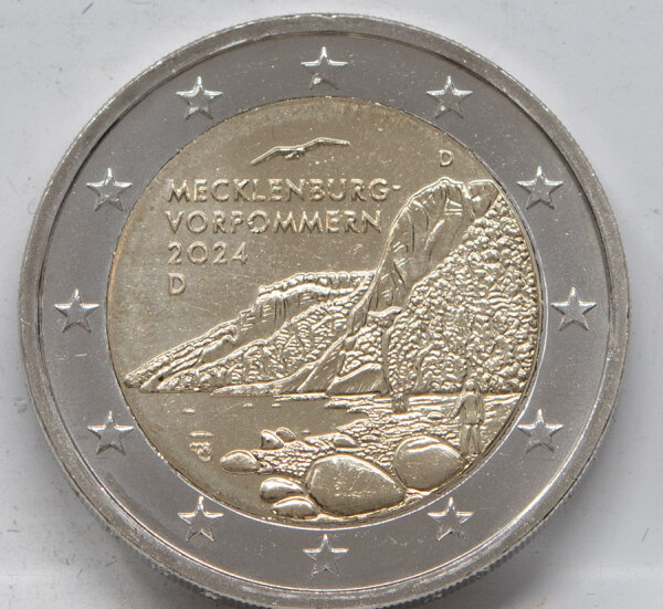 Runde Münze mit geprägtem Portraitprofil-Motiv, Brilliant Uncirculated, feine Oberflächenstruktur.