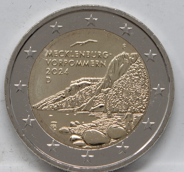 Runde Münze mit geprägtem Portraitprofil-Motiv, Brilliant Uncirculated, feine Oberflächenstruktur.