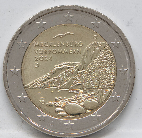 Runde Münze mit geprägtem Portraitprofil-Motiv, Brilliant Uncirculated, feine Oberflächenstruktur.