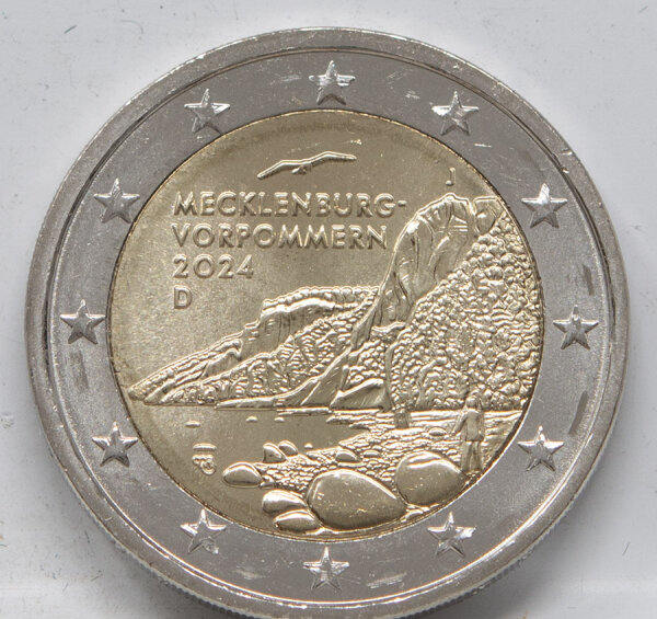 Runde Münze mit geprägtem Portraitprofil-Motiv, Brilliant Uncirculated, feine Oberflächenstruktur.