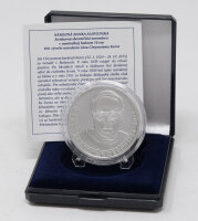 Runde Münze mit geprägtem Portraitprofil-Motiv, Brilliant Uncirculated, feine Oberflächenstruktur.