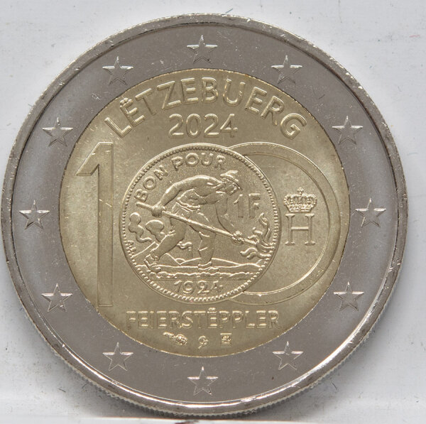 Runde Münze mit geprägtem Portraitprofil-Motiv, Brilliant Uncirculated, feine Oberflächenstruktur.