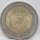 Runde Münze mit geprägtem Portraitprofil-Motiv, Brilliant Uncirculated, feine Oberflächenstruktur.