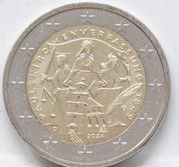 Runde Münze mit geprägtem Portraitprofil-Motiv, Brilliant Uncirculated, feine Oberflächenstruktur.