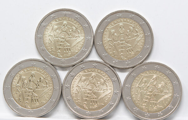 Runde Münze mit geprägtem Portraitprofil-Motiv, Brilliant Uncirculated, feine Oberflächenstruktur.