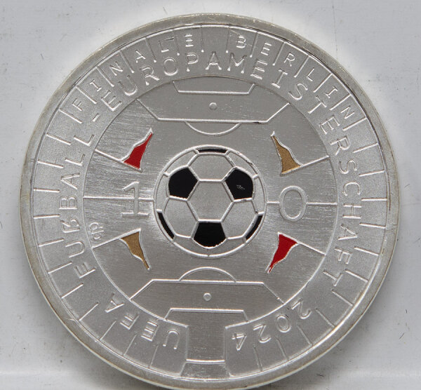 Runde Münze mit geprägtem Portraitprofil-Motiv, Brilliant Uncirculated, feine Oberflächenstruktur.