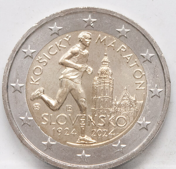 Runde Münze mit geprägtem Portraitprofil-Motiv, Brilliant Uncirculated, feine Oberflächenstruktur.