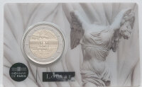 Runde Münze mit geprägtem Portraitprofil-Motiv, Brilliant Uncirculated, feine Oberflächenstruktur.
