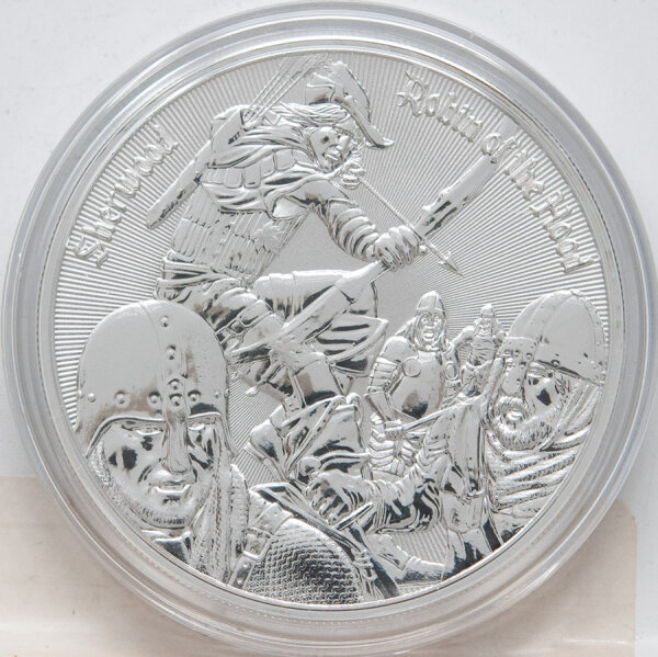 Runde Münze mit geprägtem Adler-Motiv, Spiegelnder Hintergrund mit matten Reliefs.