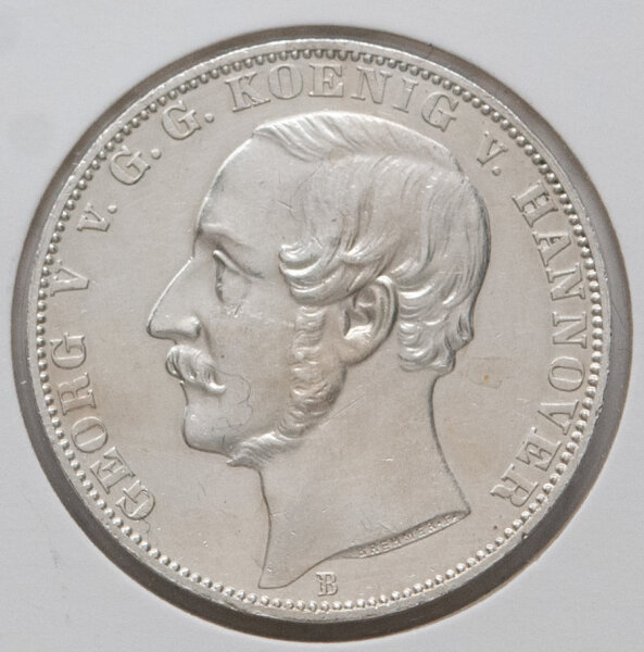Vereinstaler 1865, Vorderseite mit Portrait von König Georg V. und Umschrift „Georg V. G. G. Koenig v. Hannover“, unten Münzzeichen B.