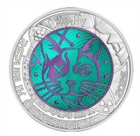 Die Niobmünze 2025 im geöffneten roten Original-Etui der Münze Österreich, inklusive des beiliegenden, nummerierten Echtheitszertifikats.