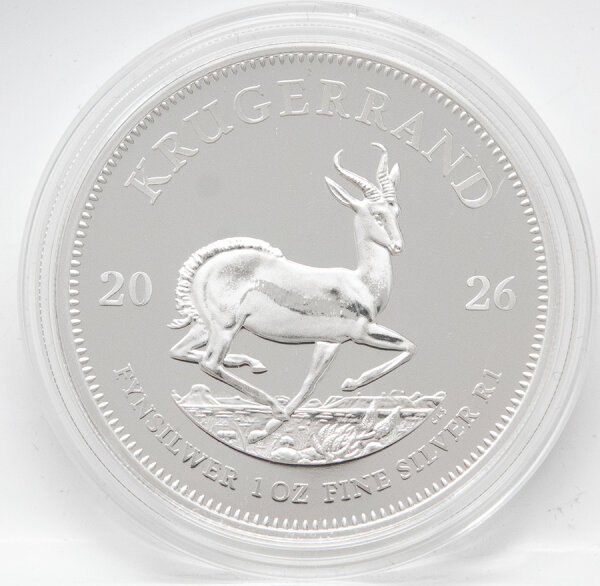 Kompletter Lieferumfang: Der Silber Krügerrand 2026 sicher gebettet im schwarzen Original-Etui der South African Mint, daneben das offizielle Echtheitszertifikat.