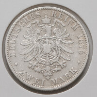Rückseite der Münze: Der bekrönte kleine Reichsadler mit großem Brustschild, typisch für die frühen Prägejahre. Die Umschrift zeigt den Jahrgang 1876 und den Nennwert „ZWEI MARK“.