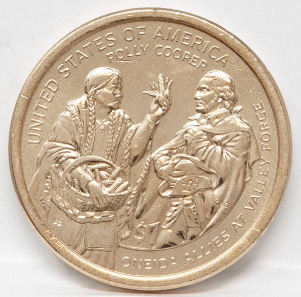 Die Rückseite (Revers) der 1-Dollar-Münze zeigt zwei Personen: Eine Oneida-Frau (Polly Cooper) in traditioneller Kleidung hält einen geflochtenen Korb voll mit Maiskolben und reicht einem Soldaten der Kontinentalarmee einen Kolben. Über der Szene stehen die Texte UNITED STATES OF AMERICA und POLLY COOPER, am unteren Rand ONEIDA ALLIES AT VALLEY FORGE und der Nennwert $1.