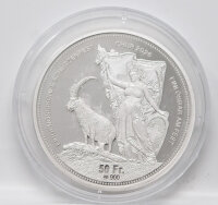 Prachtvolle Vorderseite des Silberschützentalers 2026: Ein majestätischer Bündner Steinbock vor der Skyline von Chur und den Schweizer Alpen, kombiniert mit der klassischen Helvetia-Symbolik, die in der kühlen Eleganz des Silbers höchste Detailtiefe ausstrahlt.