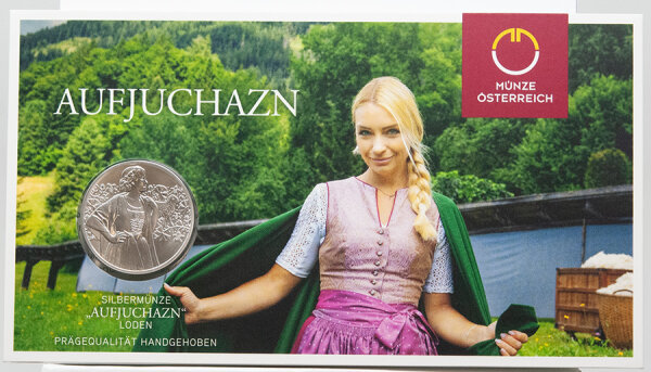 Rückseite zeigt die lebendige Darstellung des Aufjuchazns umrahmt von Lodenstrukturen.