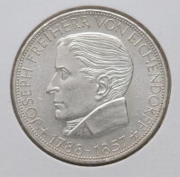 Vorderseite der 5-DM-Silbermünze 1957 mit dem Porträt von Joseph Freiherr von Eichendorff nach links. Klare Konturen und sauberes Schriftbild.